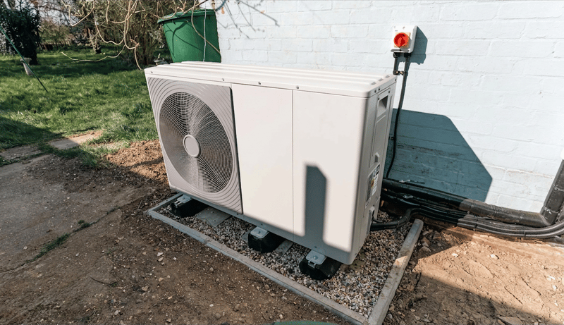 Terraced house with heat pump on exterior wall