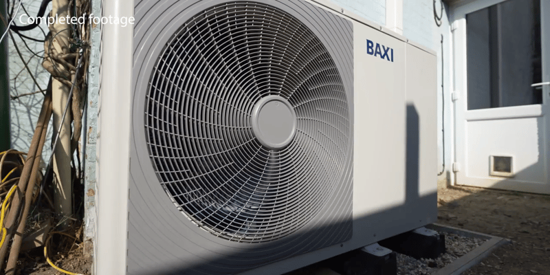 image of a heat pump outside a house